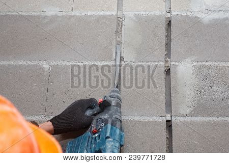 Slotting Of The Wall Under The Wiring With A Perforator.