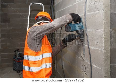 Slotting Of The Wall Under The Wiring With A Perforator.