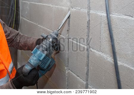 Slotting Of The Wall Under The Wiring With A Perforator.