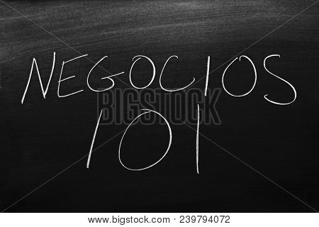 The Words Negocios 101 On A Blackboard In Chalk.  Translation: Business 101