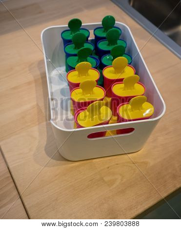 Classic Popsicle Mold Set In Freezer Container For Homemade Ice Lolly In Summer.