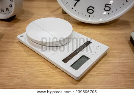 Electronic Scales For Multi-purpose Weighing On Wooden Table