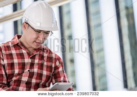 Asian Business And Engineer Man With Red Scott Shirt Has Planning And Working For Design Buiding And