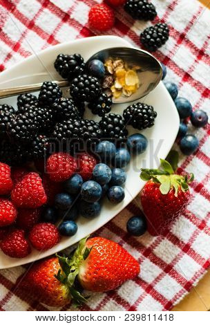 Macro View Of Blackberries, Blueberries, Raspberries And Muesli