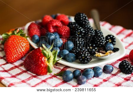 Macro View Of Blackberries, Blueberries, Raspberries And Muesli
