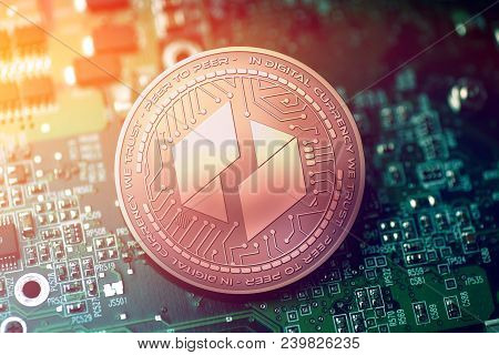 Shiny Copper Ubiq Cryptocurrency Coin On Blurry Motherboard Background Token