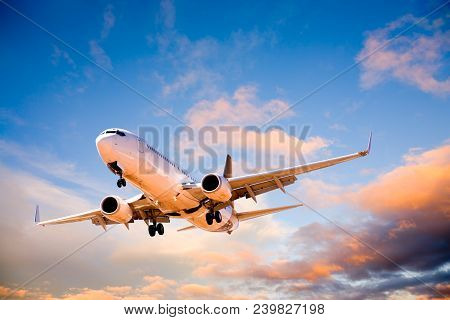 Aeroplane Pr Airplane Or Aircraft Flying In Beautiful Sunset Sky.
