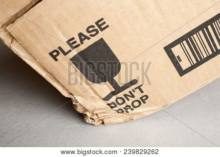 Cardboard Box Dropped Despite Warning