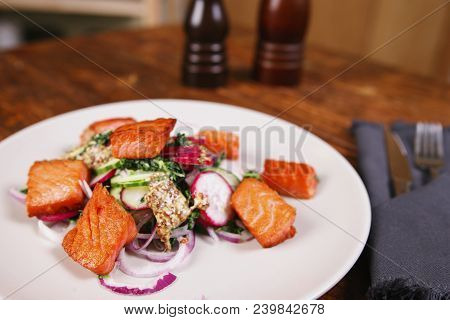 Red Fish Salmon With Radish And Spinach, Served On White Plate On Wooden Table. Rustick Style. View 