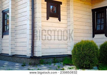 Beautiful Log House On A Hill Green Bushes Around The House