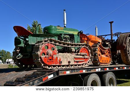 Dalton, Minnesota, Sept 8, 2017: Several Restored  Cletrac (tractor On Tracks) Loaded On A Flat Bed 