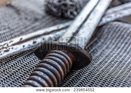 Crossed Swords On Chain Armor, Close-up, Historical Ancient Weapon Concept
