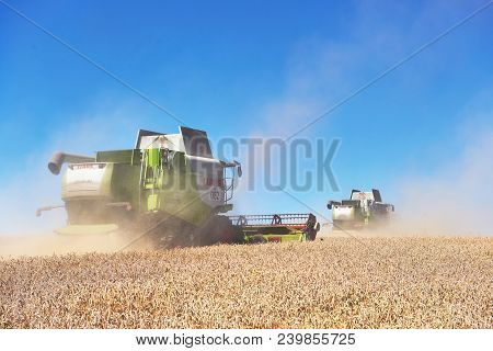 Ternopil - July 20: A Few Combines Cutting A Swath Through The Middle Of A Wheat Field During Harves