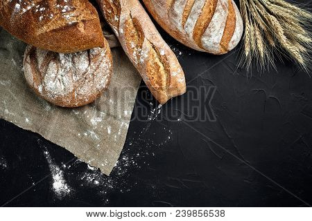 Bakery - Gold Rustic Crusty Loaves Of Bread And Buns On Black Chalkboard Background. Still Life Capt