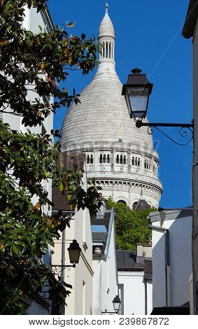 The Basilica Sacre Coeur Is A Roman Catholic Church Located At The Summet Of The Butte Montmartre , 