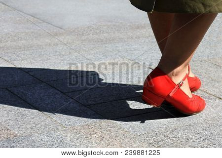 Woman In Red Shoes