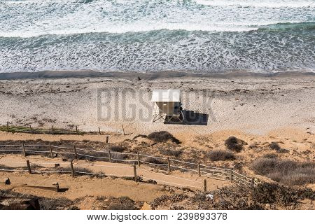 View From Above Of A Lifeguard Station And A Dirt Trail Providing Beach Access At Beacon Beach In En