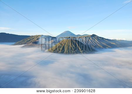 Bromo Mountain Is An Active Volcano. Landscape View Of Bromo Mountain With Fog Around The Valley Fro