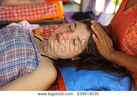 Beautiful Young Teenager Girl Getting An Outdoor Face Massage.