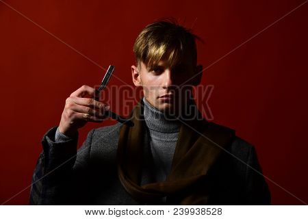 Man In Vintage Style Holds Razor Blade In His Hand. Barbershop And Style Concept. Stylist In Suit An