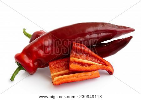 Two Ramiro Sweet Pointed Peppers Isolated On White And Two Cut Pieces Without Seeds.