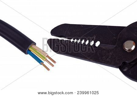 Three Core Pvc Cable And Stripping Pliers Tool Isolated On White.