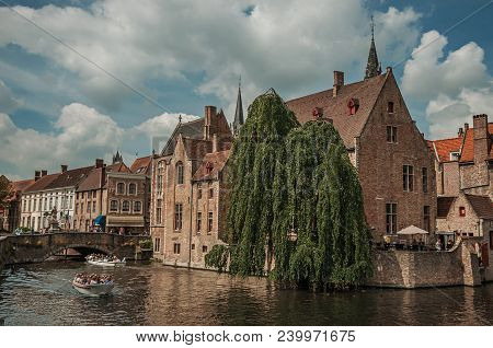 Bruges, Belgium - July 05, 2017. Boats And Old Buildings On The Canal Edge At Bruges. With Many Cana