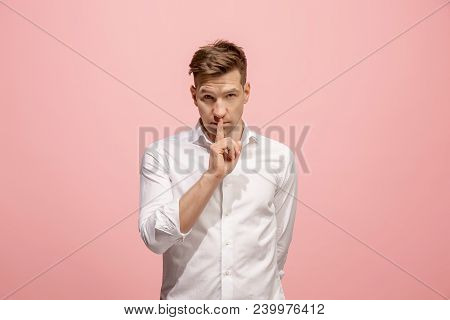 Secret, Gossip Concept. Young Man Whispering A Secret Behind His Hand. Businessman Isolated On Trend