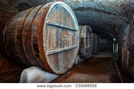 Old Wooden Barrels In The Vintage Wine Cellar.  Lefkadia, Russia
