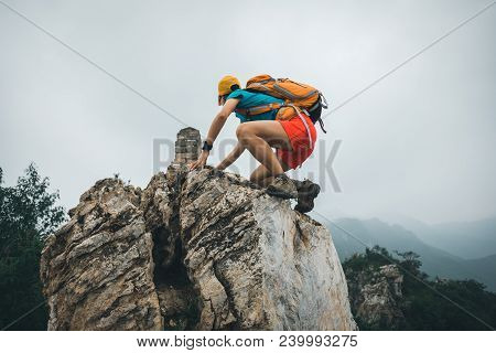Successful Woman Hiker Hiking On The Top Of Mountain