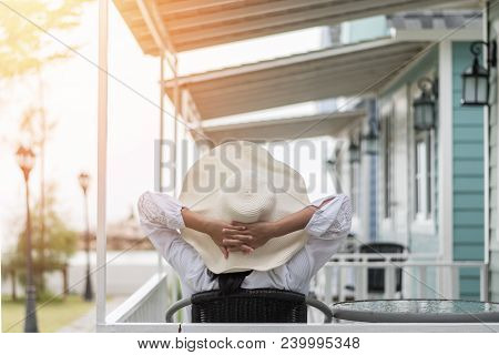 Summer Vacation Lifestyle With Young Girl Wearing Sunscreen Hat On Sunny Day Relaxing Taking It Easy