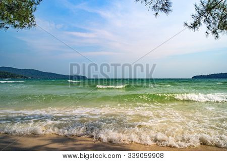 Tropical Beach. Coniferous Trees Over A Beautiful Beach With Yellow Sand. Coast Of Island Koh Rong S