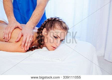Girl Masseur Doing Massage Back Spa Health