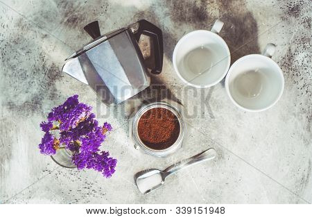 Beautiful Coffee Composition. Geyser Coffee Maker, Two Cups For Coffee, Spoon And Flower Bouquet Are