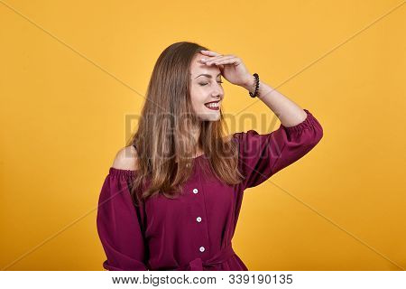 Young Ginger Woman Over Isolated Orange Wall Has Realized Something And Intending The Solution. Girl