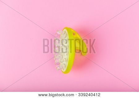 Massage Brush On A Pink Background. Gel Brush Green. View From Above. Different Angles. Massage Brus