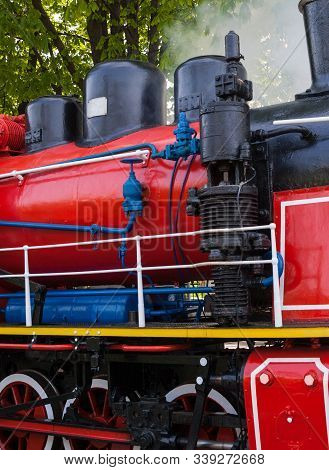 Old Steam Locomotive Blowing Off The Steam Out Of The Whistle.