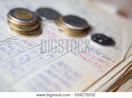Hand-written Calculations And Coins. Bookkeeping (accounting). Economy. Financial Themes. Money Savi