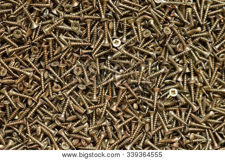 Yellow Self-tapping Screws With Countersunk Head, Background.