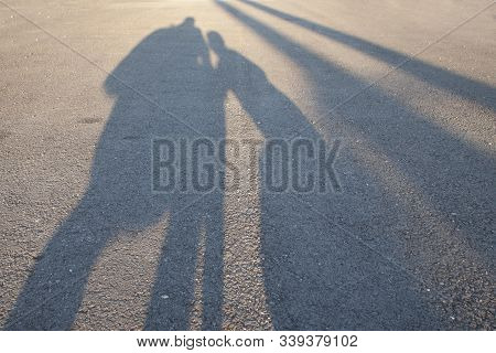 The Shadow Of The Child In The Embrace Of The Parent Symbolizes The Safety, Tenderness And Love Of T