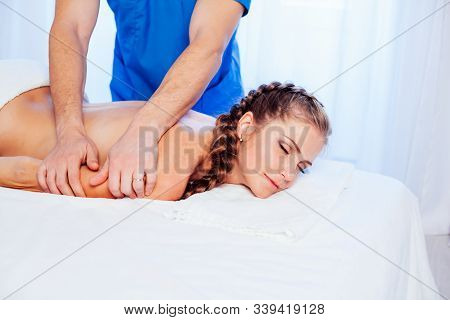 Girl Masseur Doing Massage Back Spa Health