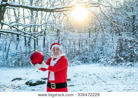 Christmas Celebration Holiday. Merry Christmas And Happy New Year Concept. Santa In Red Suit Walking