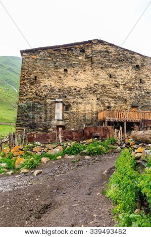 View Of The Ushguli Village At The Foot Of Mt. Shkhara. Lamaria Monastery, Rock Tower Towers And Old