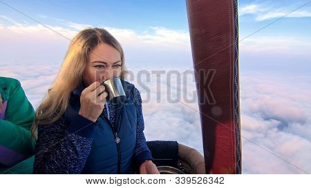 Woman Eat Sandwich And Drinks Tea And Coffee In Flight. Adventure On Hot Air Balloon. Fly In Morning