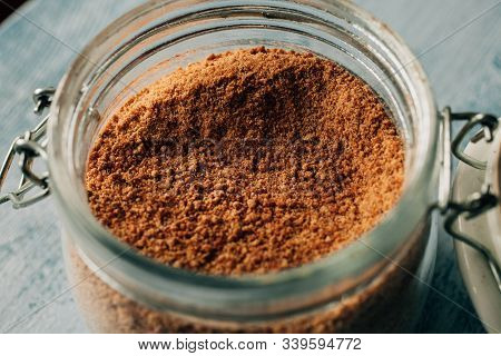 Close Up View Of Raw Cane Sugar In A Jar. Panela Sugar Background. Organic And Healthy Food.