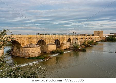 Roman Bridge, Across Guadalquivir River With Torre De Calahorra, Calahorra Tower In Cordoba, Andalus