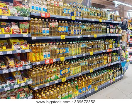 Bryansk, Russia - December 15, 2019: A Showcase With Bottles Of Sunflower Oil In The Perekrestok Sto