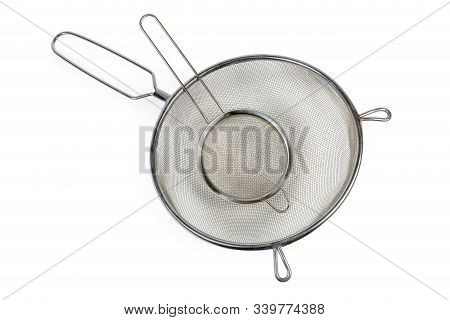 Two Round Stainless Steel Sieve Different Sizes With Wire Mesh On A White Background, Top View