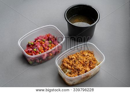 Pasta With Minced Meat And Onion In Navy-style And A Jar Of Vinaigrette On A Gray Background. Food F