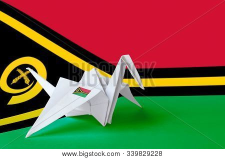 Vanuatu Flag Depicted On Paper Origami Crane Wing. Handmade Arts Concept